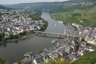 High angle view of river and town in city