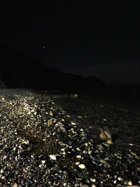 Scenic view of sea against sky at night