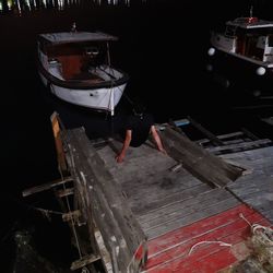 High angle view of man working on boat
