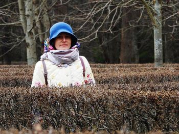 Portrait of cute girl in snow on field