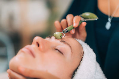 Woman lying for beauty treatment at spa