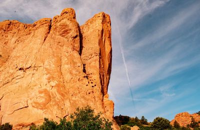 Low angle view of rock formation against sky