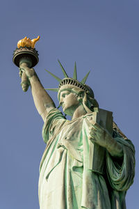 The statue of liberty is a majestic sight symbolizing the desire for freedom and democracy