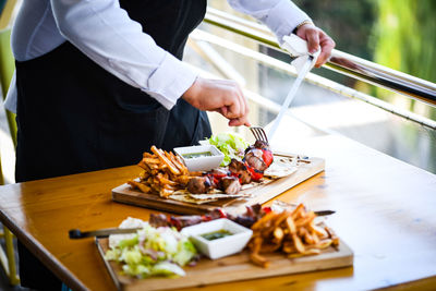 Man preparing food on table