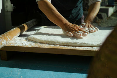 Midsection of person preparing food