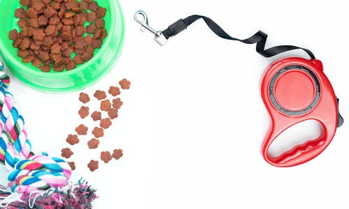 High angle view of candies on table against white background