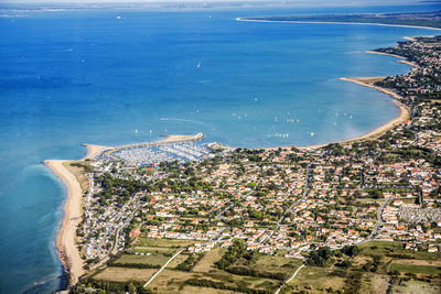 High angle view of city by sea