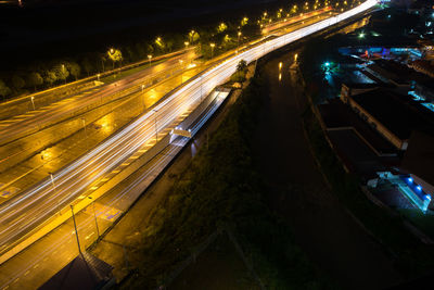 High angle view of light trails on road at night