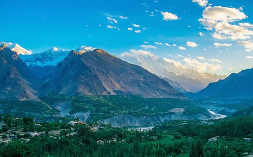 Scenic view of mountains against blue sky