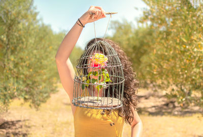 Close-up of a person holding a bird