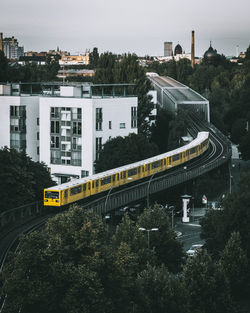 High angle view of train on bridge in city