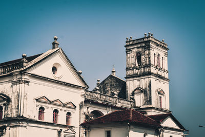 Low angle view of illuminated building against clear sky