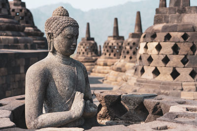 Buddha statue in temple outside building