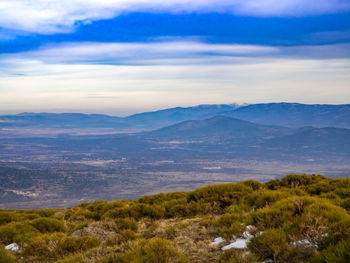 Scenic view of landscape and mountains against sky