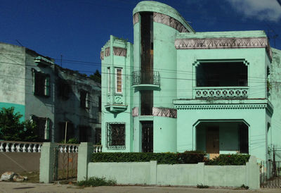 Low angle view of building against blue sky