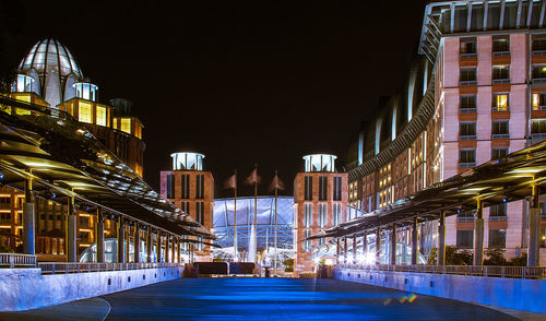 Illuminated buildings in city at night