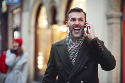 Portrait of young man using mobile phone