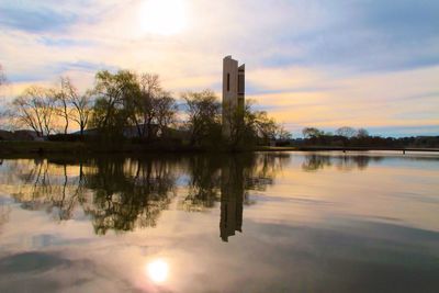 Scenic view of lake at sunset