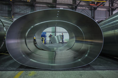 Two workers in steel factory