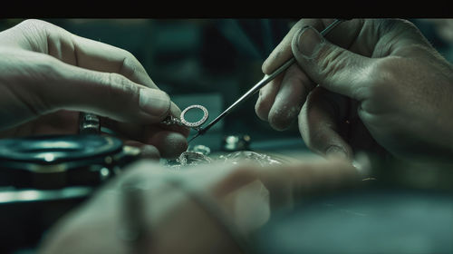 Cropped hand of man repairing car