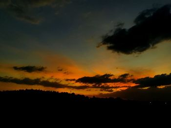 Low angle view of dramatic sky during sunset