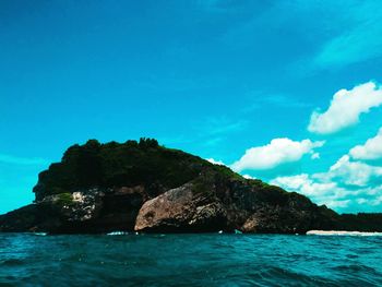 Scenic view of sea against blue sky