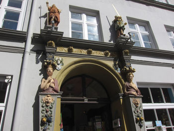 Low angle view of statue against building