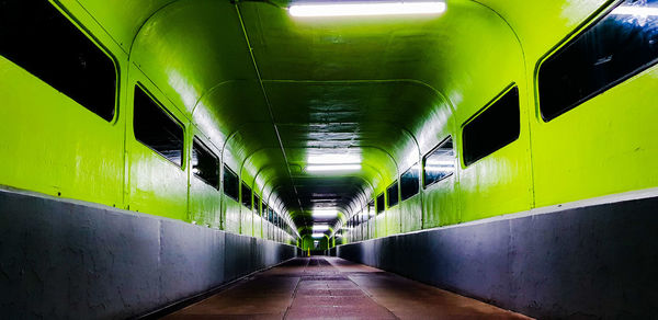 Empty illuminated subway tunnel