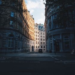 Buildings in city against sky