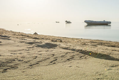 Scenic view of beach against clear sky