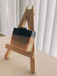 Close-up of chair on table at home