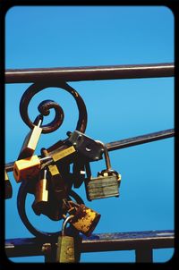 Low angle view of metallic structure against blue sky