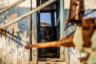 Rusty metal window of old boat