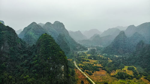 Scenic view of limestones mountains against sky in cat ba island, vietnam.