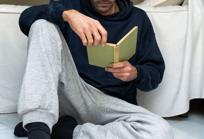 Midsection of woman holding gift box