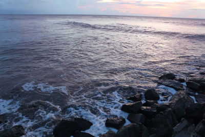 Scenic view of sea against sky during sunset