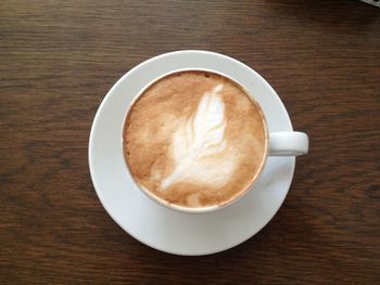 High angle view of cappuccino on table