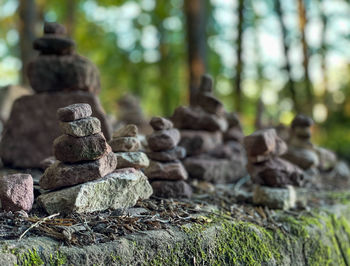 Stack of stones on rock in forest