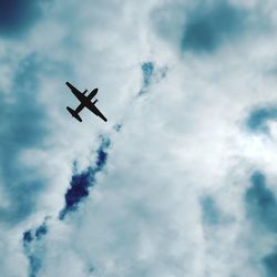 Low angle view of airplane against sky