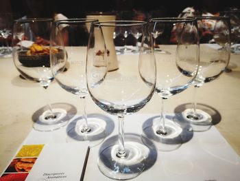 Close-up of wine glasses on table