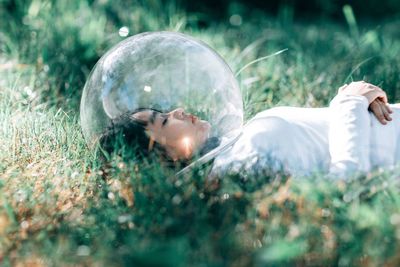 Young woman lying down on land