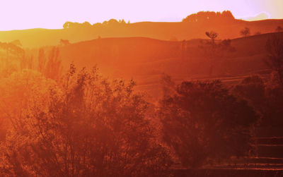 Scenic view of mountains against sky during sunset