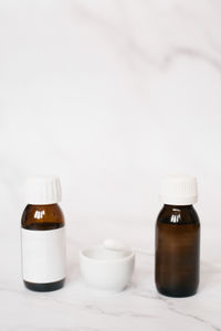 Close-up of bottles on white background