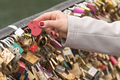 Close-up of love locks hanging on chainlink fence