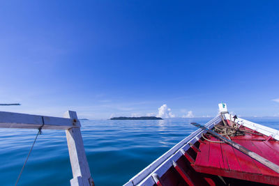 Scenic view of sea against blue sky