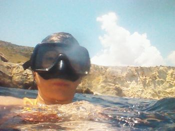 View of turtle on rock in sea