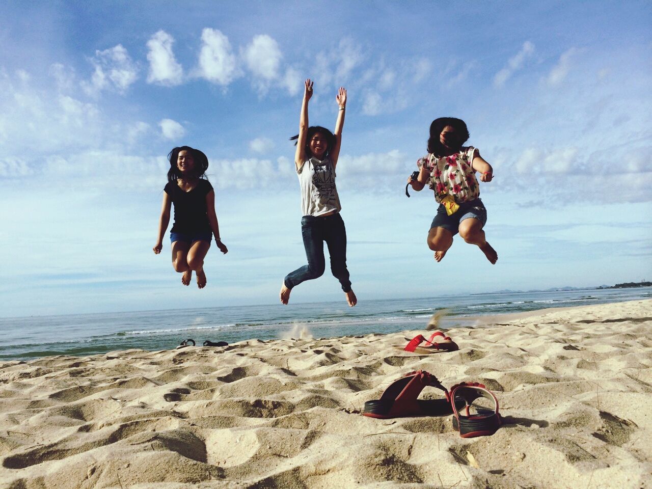 lifestyles, leisure activity, full length, beach, casual clothing, sky, vacations, sand, togetherness, shore, sea, rock - object, childhood, boys, person, fun, enjoyment