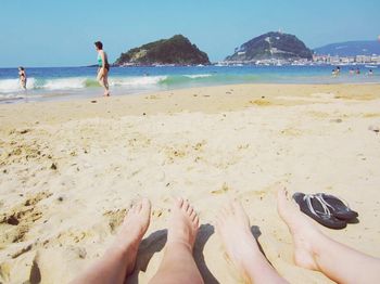 Tourists relaxing on beach