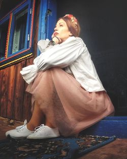 Side view of young woman looking away