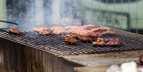 Close-up of meat on barbecue grill